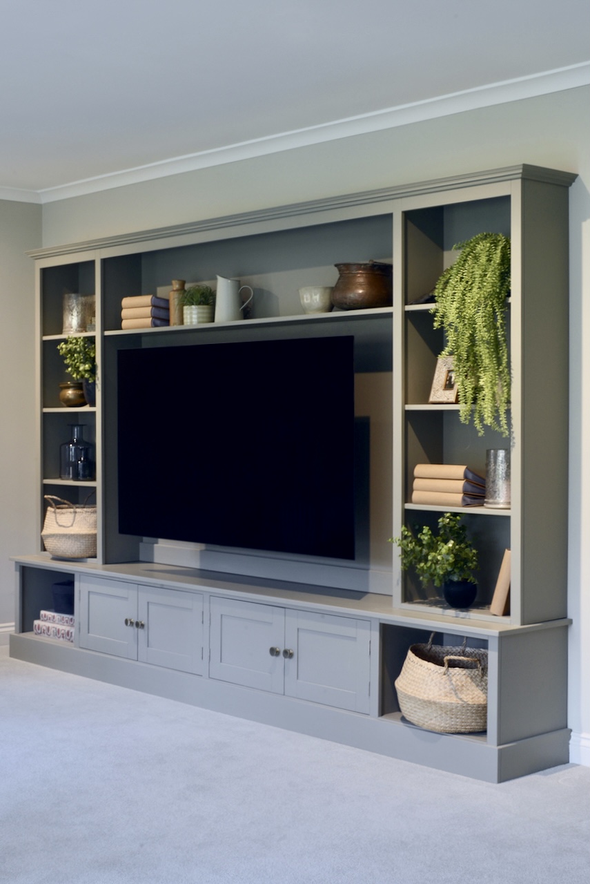 Custom-built TV media wall with oak dresser storage by Nest at Number 20
